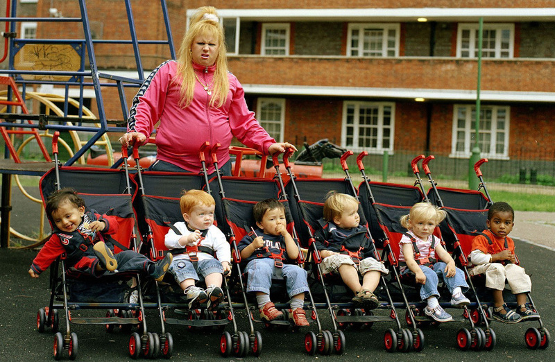 Vicky Pollard, a character in Matt Lucas and David Walliam’s ‘Little Britain’ is pushing five prams with a diverse range of toddlers

